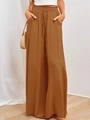 Détail d'un pantalon large en lin à taille haute avec cordon de serrage et poches - Jaune Foncé