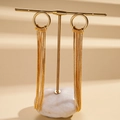 Detail of 18K gold plated long tassel earrings featuring delicate snake chain fringes - Gold