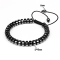 Macro detail of hematite disk beads and adjustable cord on a men's energy bracelet - 8x4mm Thick Flat Bead