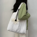 Detail of white pleated canvas tote bag with a large floral charm on a shoulder strap - Flower Charm Style / White