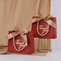 Elegant red wedding gift bag with gold Thank You text and a satin bow ribbon - Wine Red Thank You + Champagne Gold Ribbon
