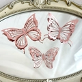 Three rose gold 3D cutout paper butterflies in various sizes on a vintage mirror - Style 3 / Set of 12 / Rose Gold