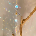 Golden diamond-frame suncatcher with crystals and sun pendant on a wooden branch - B20 Style