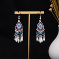 Detailed shot of ethnic tribal earrings with red and blue enamel drops and silver tassels - Red Blue Enamel Long Tassel(E7274)