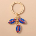 Portachiavi dorato con tre ciondoli da football americano in smalto blu e rosso su anello - 3 palloni da rugby (Blu)