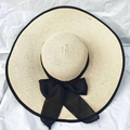Women's beach straw sun hat in beige with large black mesh bow and wide brim detail - One Size (55-58cm) / Black Trim Beige