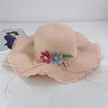 Detail of pink straw sun hat with 3D floral accents and wavy openwork brim - Adult M (56-58cm) / Light Pink