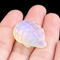 Miniature opalite hedgehog figurine with iridescent finish on a black background - Opal (Synthetic)