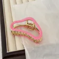 Elegant wavy pink hair claw clip with gold metal interior for a stylish hair bun look - Rose Pink