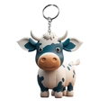Close-up of a 3D cartoon highland cow keychain with blue spots and silver metal ring - White Body Blue Spotted Cow Style