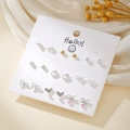 Set of 12 mixed geometric heart earrings with pearls and crystals on card display - Gold Pink Colorblock Bow Heart Earrings (E1938-1)