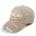 Detailed macro view of vintage beige baseball cap featuring distressed holes and embroidery - Adjustable / Khaki