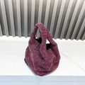 Detail shot of a high-density fuchsia rhinestone hobo bag with sparkling crystal stones - Rose Red