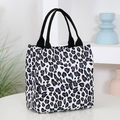 Stylish black and white leopard print tote bag with durable black woven handles - White Small