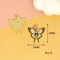 Detailed macro view showing the front enamel butterfly charm and dimensions of 24x22mm - Black Pink