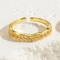Detail of wavy adjustable ring band with sparkling cubic zirconia inlays in gold - Wavy White Zircon