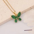 Macro detail of a gold butterfly necklace with emerald green faceted zircon stones - Butterfly Style (4#)