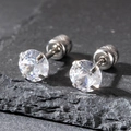 Macro detail of 6mm round zircon stud earrings with silver-tone four-prong setting - 6mm / Silver