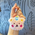 Pink plush bear keychain with party hat and fluffy texture for backpack decor - Pink