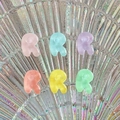 Close-up of translucent colorful resin alphabet R charms for DIY phone case accessories - Letter R