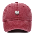 Vintage washed dark red baseball cap with white tooth embroidery in a front view - Burgundy