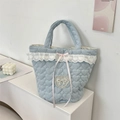 Detail of light blue quilted tote bag with lace heart embroidery and pink ribbon bow - Heart Light Blue