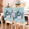 Vue détaillée des housses de chaise de Noël en lin bleu avec bonhomme de neige et texte JOY - YT03-1 (Bonhomme de Neige Bleu JOY)