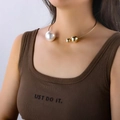 Detail of gold metal choker featuring a large pearl and two small gold beads on a model - Sliding Ball Pearl Choker (S401) / Steel