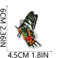 Macro detail of butterfly embroidery patch showing 6cm x 4.5cm size measurements - Multicolor Butterfly