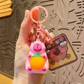 Pink capybara silicone keychain pendant holding a lucky orange ball with matching hook - Light-up Capybara - Pink