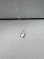 Close-up of silver padlock pendant with white mother of pearl inlay on a minimalist chain - Silver