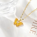 Elegant gold butterfly necklace featuring translucent yellow wings and zircon inlay finish - Gold