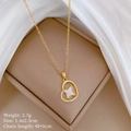Detailed view of gold heart necklace with mother of pearl and zircon in jewelry box - Gold Heart Star Pendant (C345)