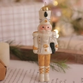 Ivory Nutcracker soldier Christmas ornament with gold glitter details and hanging string - Nutcracker Soldier