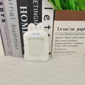 Close-up of white plush bunny ear card holder with soft texture and clear window - New White Rabbit