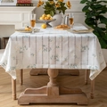 Linen table cloth with white base and delicate floral print for rectangular tables - Little Daisy Green