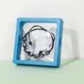 Blue sodalite beaded bracelet displayed in a square 3D floating film jewelry box - Blue