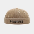 Detailed close-up of khaki miki hat featuring embroidered letters and distressed frayed holes - Adjustable / Khaki