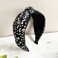 Detailed close-up of a wide leopard print headband with a stylish central knot design - Leopard Print Black