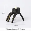 Halloween skull hand candle holder with white LED light in vintage gold finish - Vintage Skeleton Hand Lamp