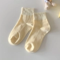 Short cotton crew socks in cream yellow with vertical rib texture and elastic cuff - Milky Yellow
