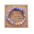 Blue stone bead bracelet with gold sunflower charm on a brown Mother's Day gift card - Blue Agate Sunflower Bracelet
