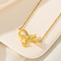Macro shot of gold plated bowknot pendant with sparkling crystals and a bee charm - Bee Bowknot (F209)