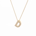 Detailed view of gold-plated D-letter pendant with sparkling cubic zirconia inlay - Letter D