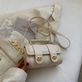 Elegante borsa a tracolla cilindrica bianco panna con fibbia dorata e tracolla regolabile - Bianco Sporco