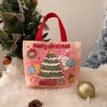 Pink canvas tote bag featuring Christmas cartoon characters and red top handles - Christmas Flying Rabbit