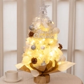 Close-up of a white mini Christmas tree with LED lights and silver ornaments - 55CM White Ribbon Set