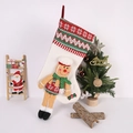 Close-up of a cream Christmas stocking featuring a 3D gingerbread man and knit cuff - Chef Hat Long Leg Gingerbread Man Christmas Stocking