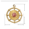 Macro detail of a vintage heart pendant in gold finish with pink natural stone - Gold Hollow Round Pink Stone