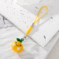 Cute 3D yellow fruit phone charm with smiley face and green leaf decoration on cord - Yellow Orange